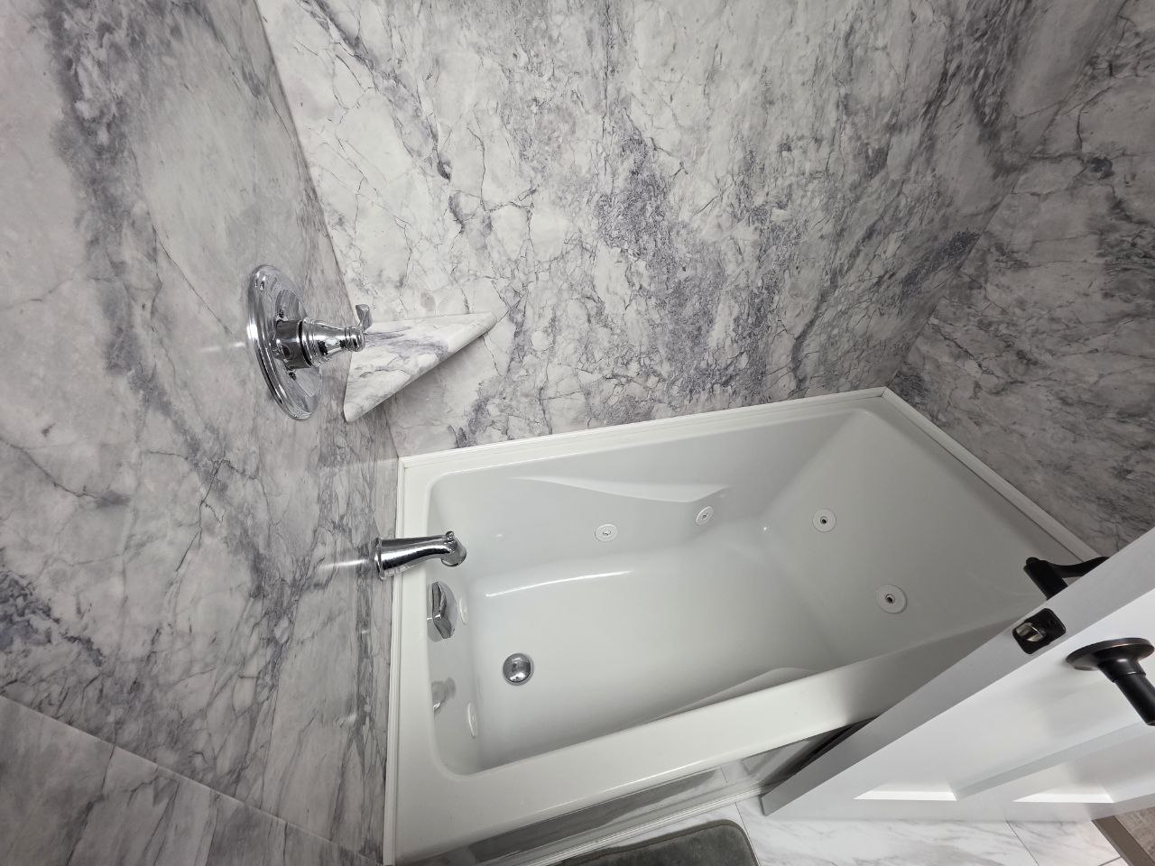 Jetted tub with marble surround - relaxing amenity in Morgantown vacation rental